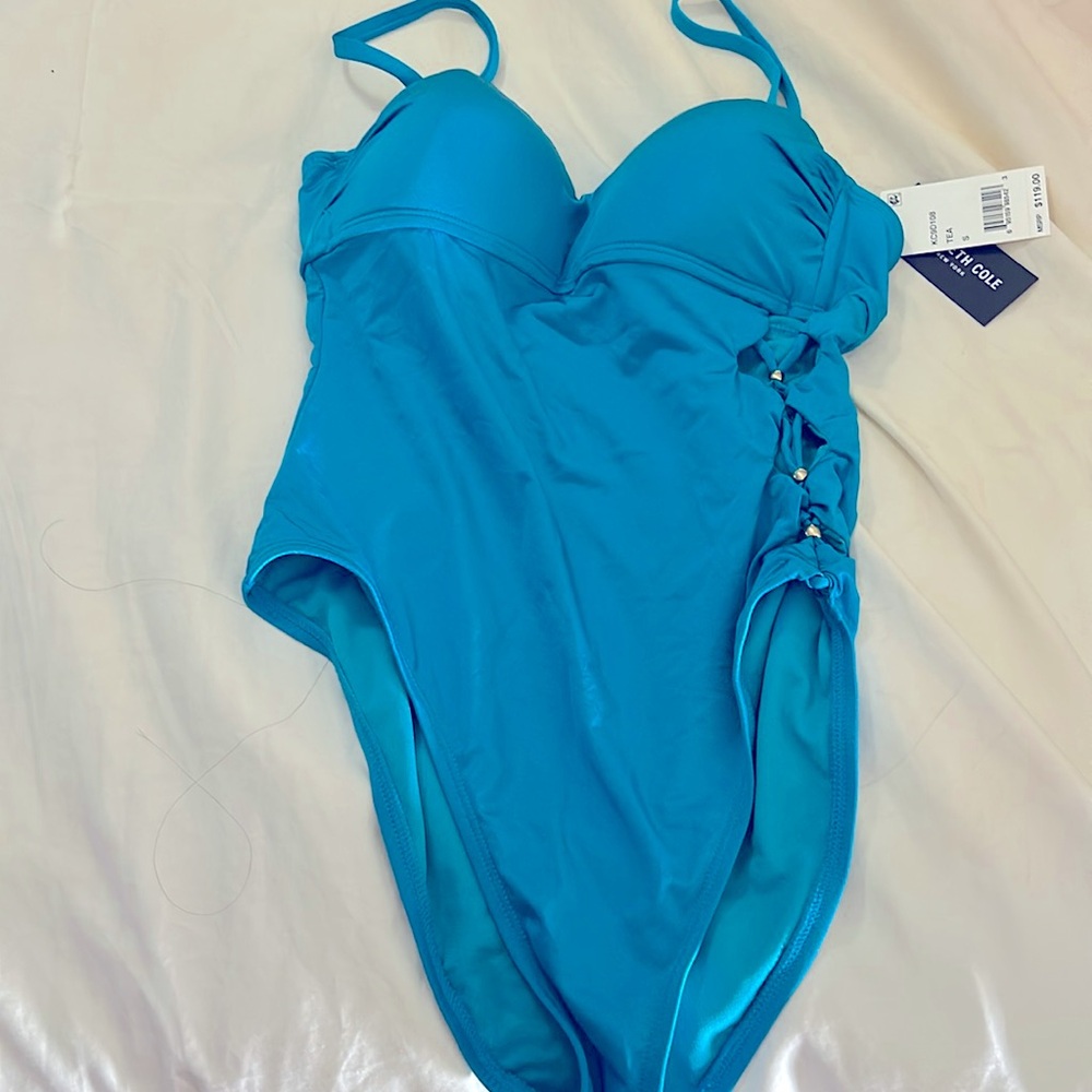 Bright blue Kenneth Cole cutout swimsuit.